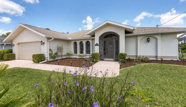 Walkin on Sunshine - canal front home with pool mins to golf and beaches