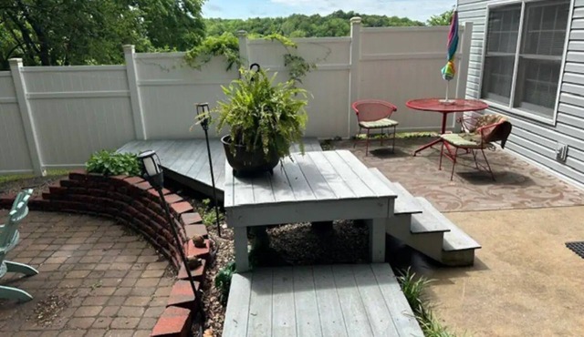 Walkout basement apartment with private patio supplied with a grill and fire pit