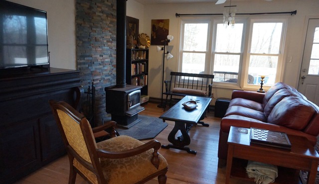 Warm cozy country cottage nestled beneath the mountains, woodstove, Catskill