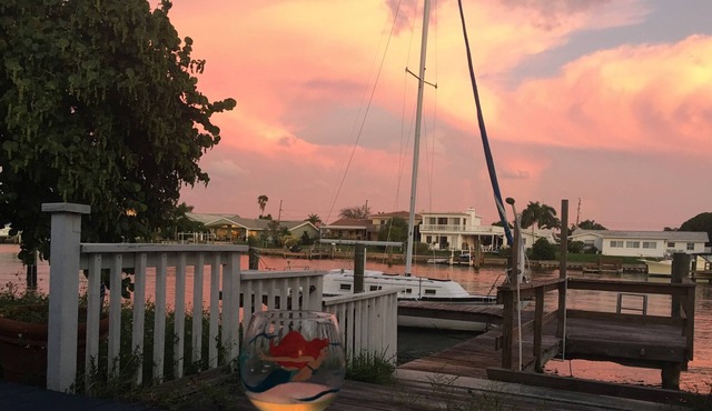 Watch sunsets from waterfront deck of 3,000 sq-ft. home in Tampa Bay beach town!