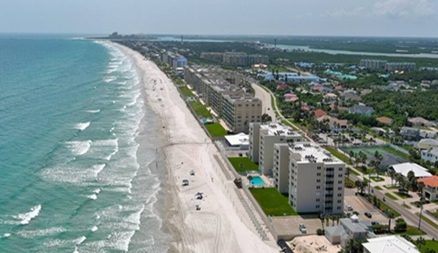 Watch the Dolphins play in the Atlantic while the gentle waves roll in.