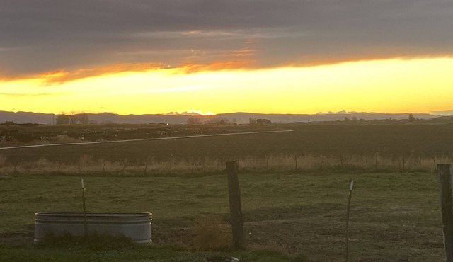 Watch the sunrise and sunset in a large country space.