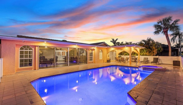 Water Front Home with Heated Pool & Hot Tub, 2 Master Suites & a Floating Dock