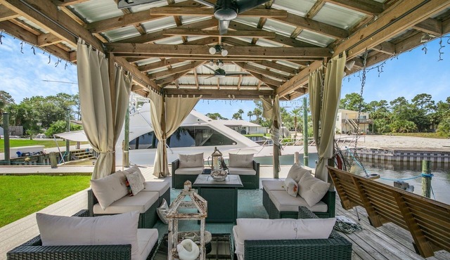 Water front home with boat dock, boat use, fishing swimming biking & more