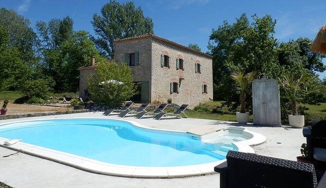 Water mill with swimming pool, waterfall, and stream