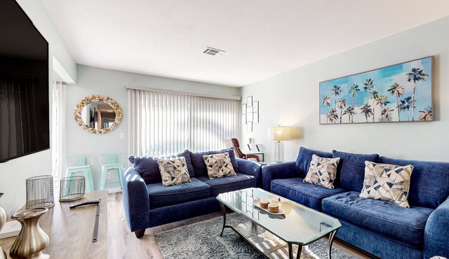 Water-view dog-friendly home with outdoor space & entertainment options
