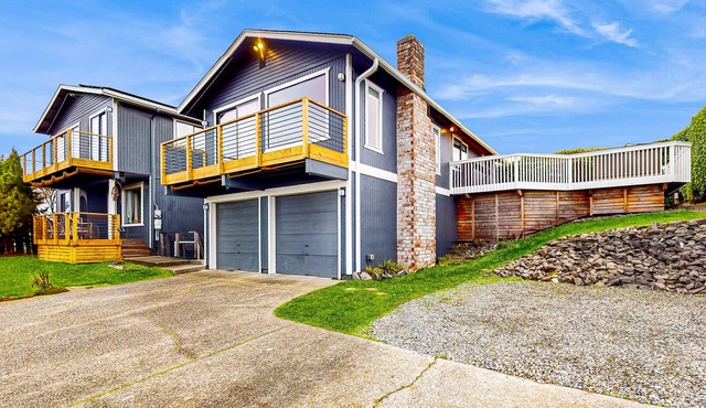 Water-view home with ADU, gated entry, hot tub, enclosed yard, deck, & 2 W/Ds