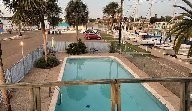 Waterfront 2 bedroom condo with pool, boat ramp and slips