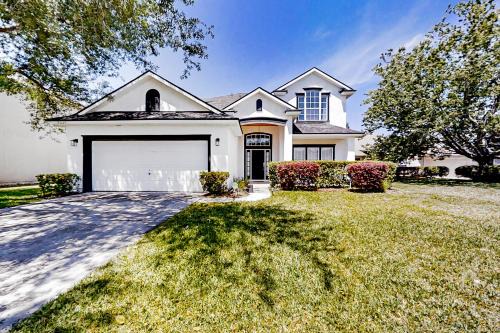 Waterfront 2-story home with water views, patio, streaming, washer/dryer, & AC