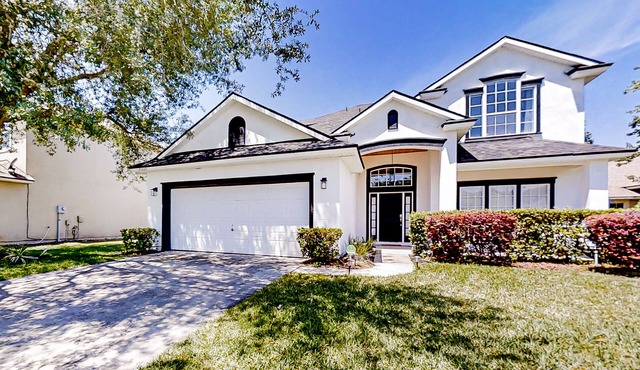 Waterfront 2-story home with water views, patio, streaming, washer/dryer, & AC