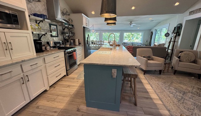 Waterfront beauty with dock and fireplace! Check in Bay! New Hot Tub!