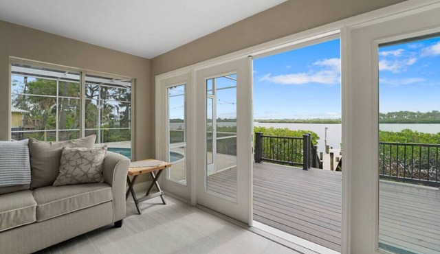 Waterfront Bliss in Bradenton, Florida: Your Dream Rental with a Screened Pool and Private Dock!