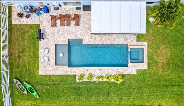 Waterfront Cocoa Beach Retreat Near Beach, Downtown with Heated Pool & Dock