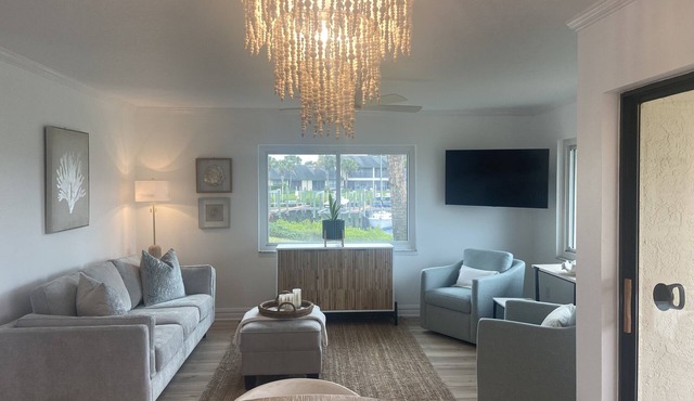 Waterfront condo, gated, dock, lanai, newly remodeled, single story.