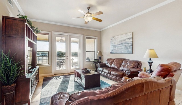 Waterfront condo with furnished balcony, central AC, & washer/dryer