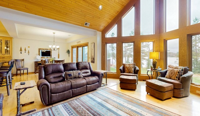 Waterfront condo with scenic balcony, fireplace, streaming, full kitchen, & W/D