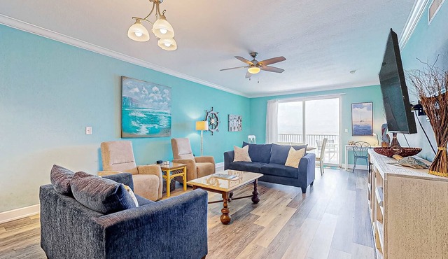 Waterfront condo with beach access, pools, balcony, central AC, & W&D