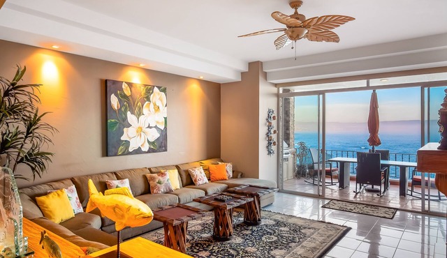 Waterfront condo with heated pool, hot tub, balcony, fireplace, & central AC