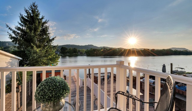 Waterfront condo with large decks and a dock for summer fun centrally located.