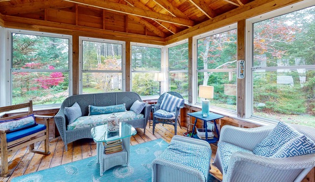 Waterfront cottage on Spruce Head Island with dock, beach access, and large yard