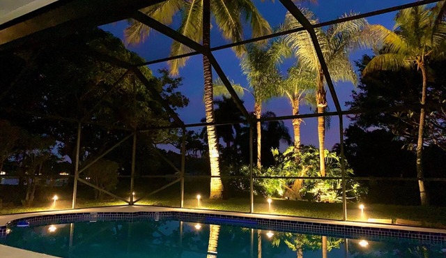 “Waterfront Elegance: Luxurious Equestrian Retreat with heated Pool”