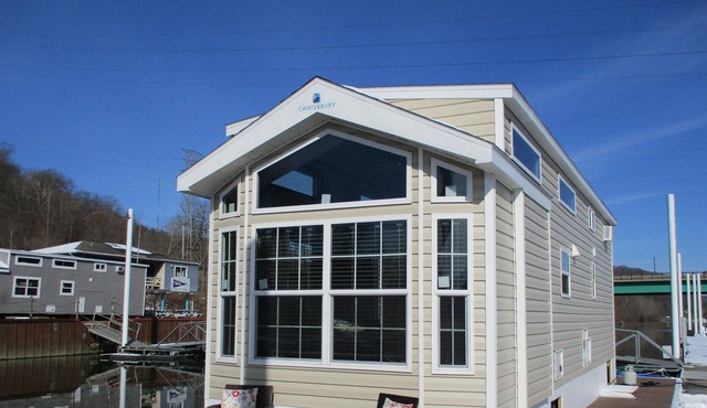 Waterfront Glamping Escape Cozy Floating Cottages on the Peaceful Beaver River