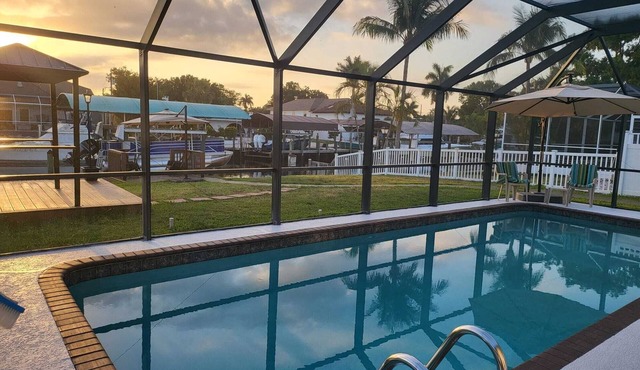 waterfront home, in a canal of the Caloosahatchee River with direct Gulf access.