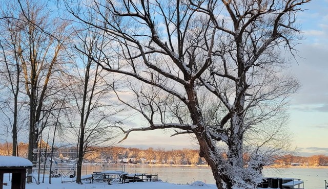 Waterfront home on Oneida Lake. Additional parking for trucks, trailers, sleds.
