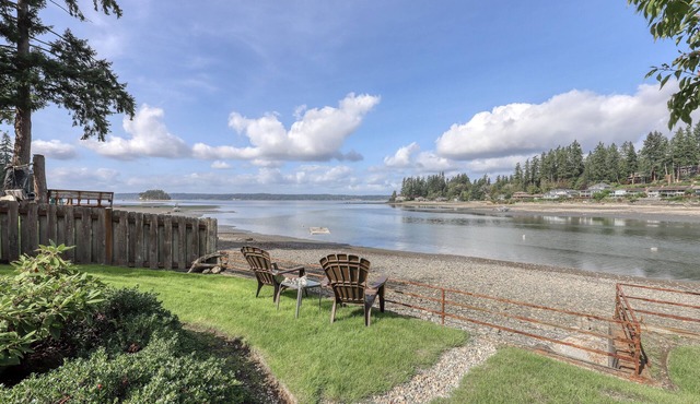 Waterfront home & on-site guest house w/full kitchens, a large deck, & firepits