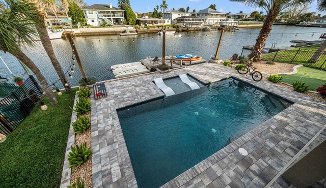 Waterfront home w/direct gulf access + pool + hot tub + activites!
