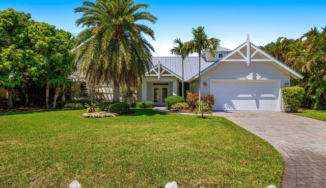 Waterfront home with heated pool + spa, patio, grill, & free WiFi - dog-friendly