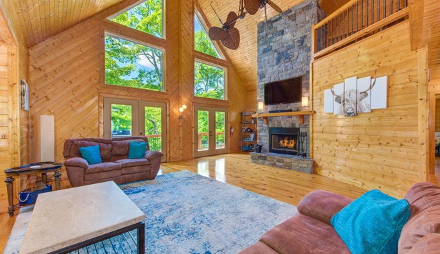 Waterfront home with game room, theater, deck, dock & fireplace