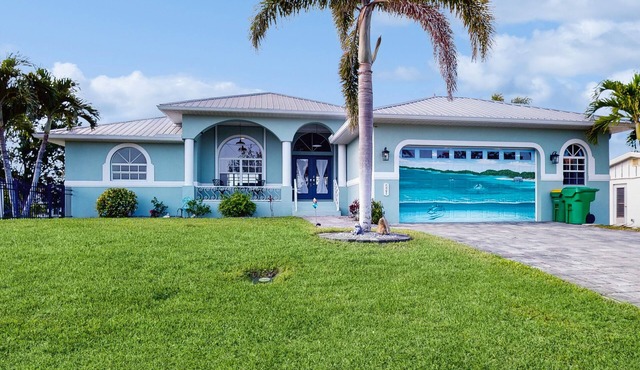 Waterfront home with saltwater pool, firepit, boat access, and dock