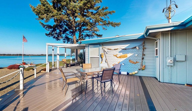 Waterfront home with panoramic bay views, deck, fireplace & beach access