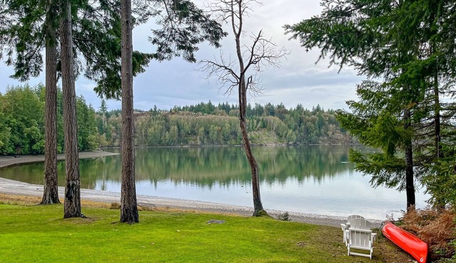 Waterfront home with private hot tub, patio, games, & gym room