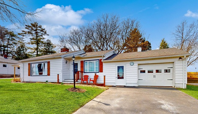 Waterfront home with stunning Owasco Lake view, dock, firepit & covered porch