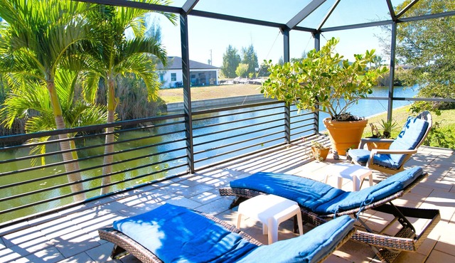 Waterfront home with oversized heated pool & spa, bikes, beach gear!