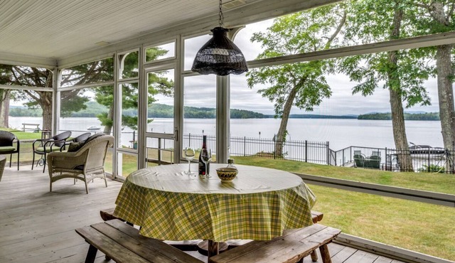 Waterfront home with boat dock, screened-in porch, large deck