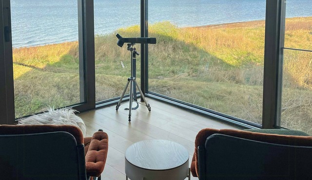 Waterfront house with stone beach in Lohals