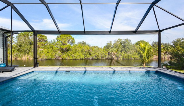 Waterfront Key West Style Home with Heated Pool Located in South Gulf Cove