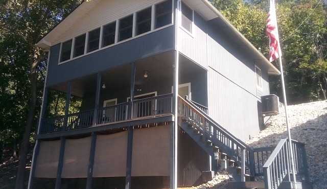 Waterfront lake home, dock, quiet swim cove next to The Cave Restaurant + many