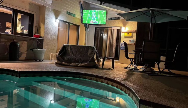 Waterfront Lake Tarpon Home with heated salt water pool, fitness room, WiFi