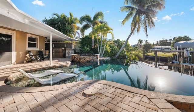 Waterfront Luxury: Pool, Dock, Hot Tub & Outdoor Kitchen