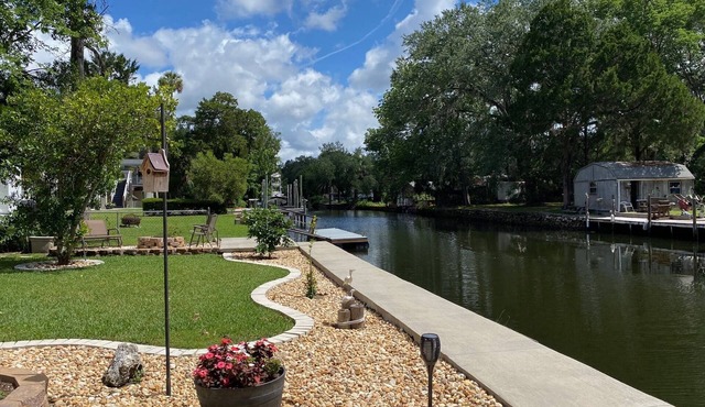 Waterfront Paradise w dock, large patio, lanai, pool, hot tub! Bring your boat!