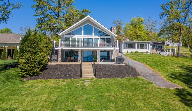 Waterfront, private boat dock, gentle slope to the water, main lake views
