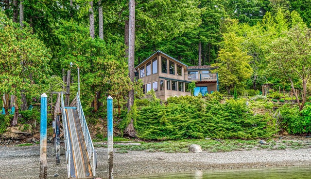 Waterfront retreat on 1.4 forested acres with amazing views & private dock