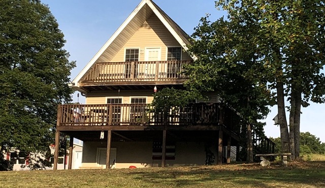 Waterfront retreat with dock. Relax, or enjoy fishing or kayaking on the water.