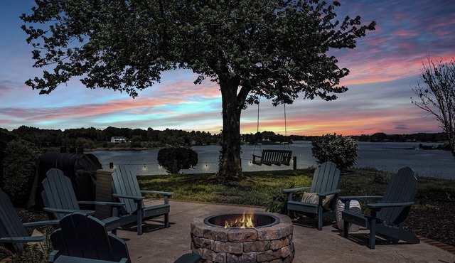 Waterfront retreat with dock, kayaks, and outdoor living. Bring the boat!