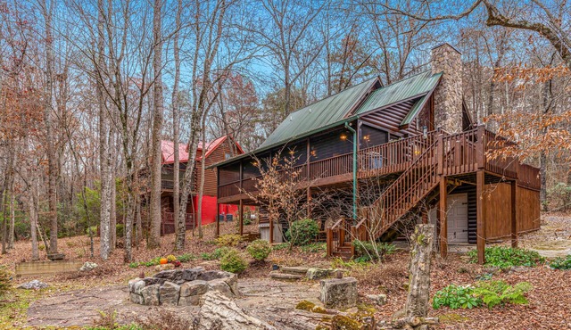 Waterfront retreat with a deck, grill, fireplace, board games, W/D, & central AC