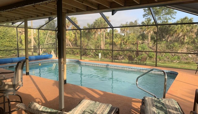 Waterfront single home rental with private lanai, heated pool, and hot tub!